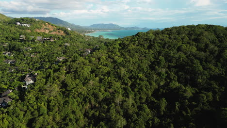 Nathon-town-in-Koh-Samui-Island-in-Thailand-at-sunset,-aerial-jib-shot-revealing