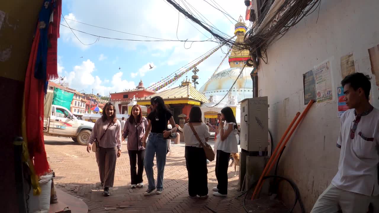 POV hyperlapse follow of Buddhist monk arriving at the the Boudha Stupa in Boudanath, Nepal