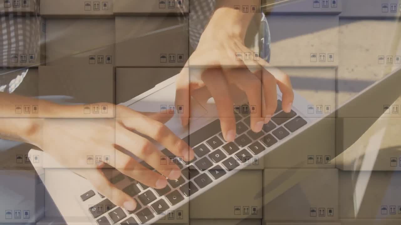 Animation of man typing on laptop keyboard with stacks of boxes in background