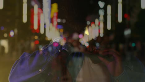 male musician playing harmonica on city street at night, with animated neon music chart overlays