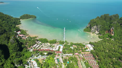 aerial toward the floating pier on east railay bay beach which is opposite to railay beach in ao nang, krabi, thailand drone dolly forward shot