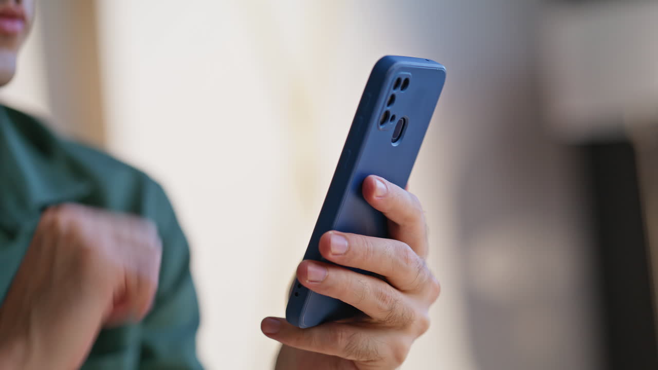 Guy choosing purchases smartphone pointing screen closeup. Unrecognizable man
