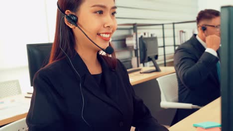 Business-people-wearing-headset-working-in-office