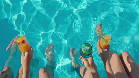 friends enjoying drinks by the pool