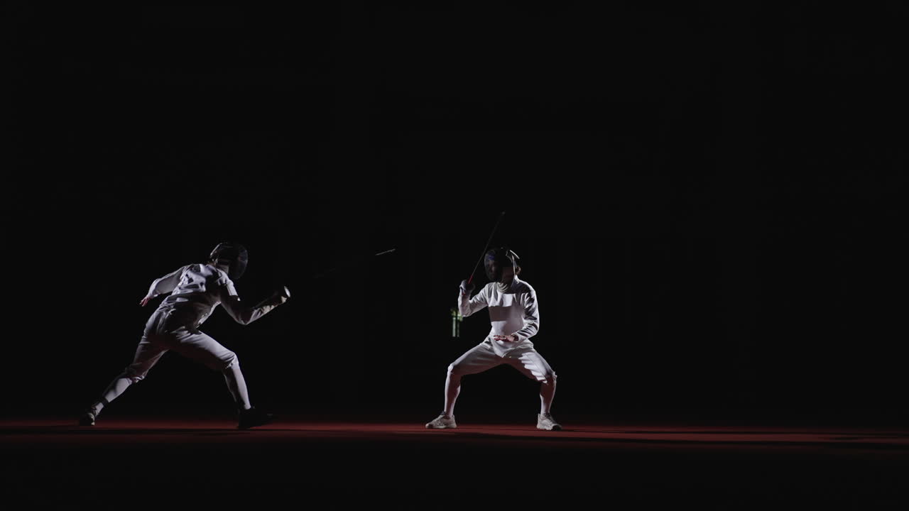 Two men fencing