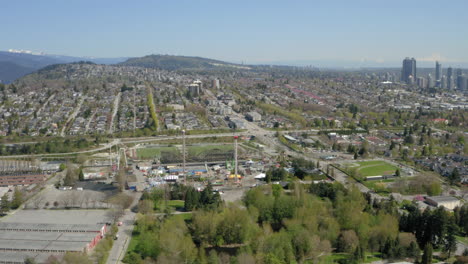 wide, sweeping aerial view of hastings sunrise and north burnaby heights and the transcanada highway one in vancouver bc canada