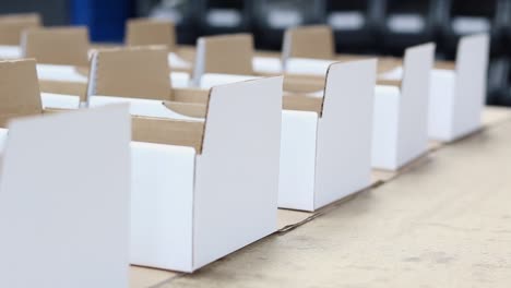 rows of boxes sit in a warehouse