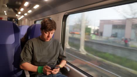 young man traveling by train