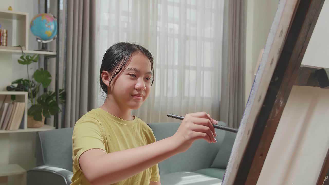 Asian Artist Girl Holding Paintbrush Mixed Colour And Thinking Before Painting On The Canvas