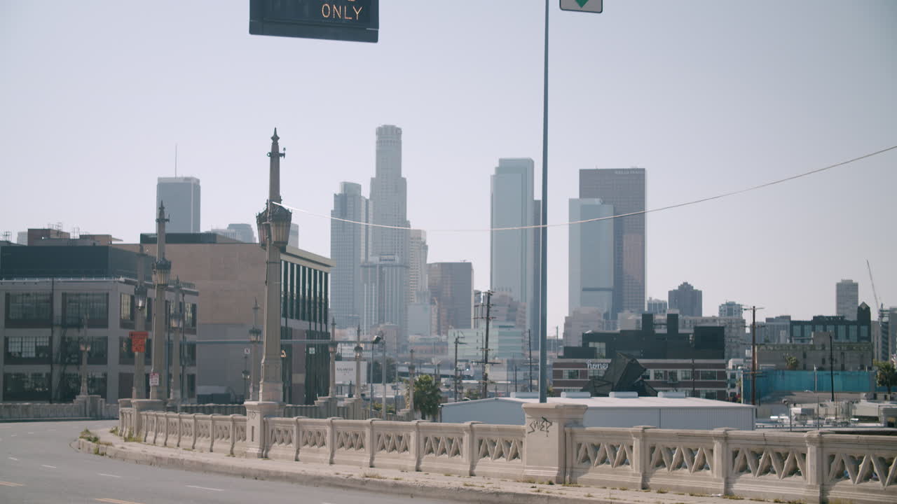 Urban Cityscape with Overhead Traffic Signs and Skyscrapers