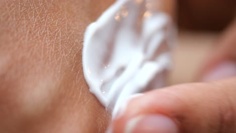 applying lotion to the skin