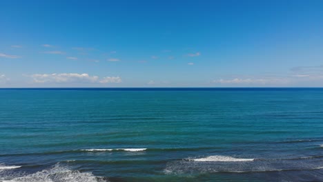 paradise sandy beach washed by blue turquoise sea water on a summer sunny day with bright sky in mediterranean