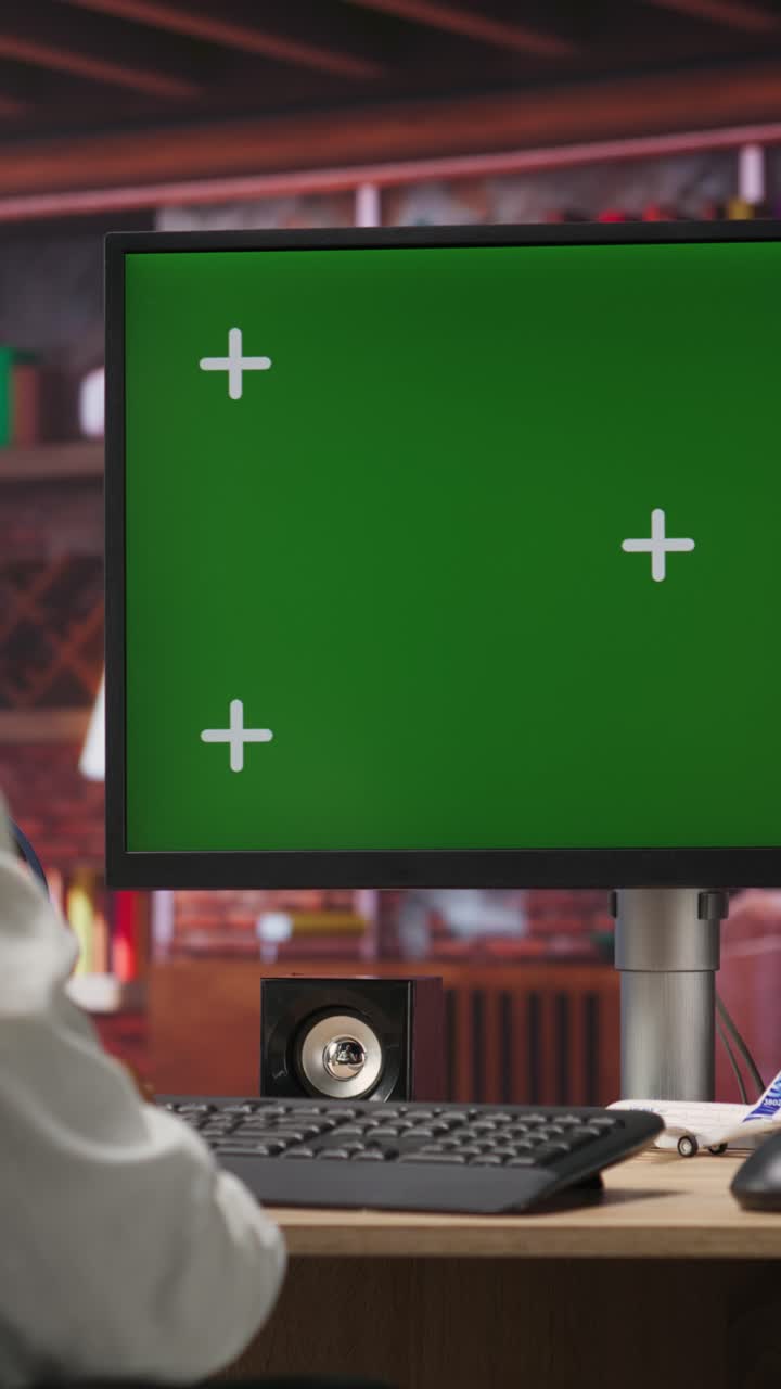 Vertical video Remote worker doing tasks on chroma key computer, typing information