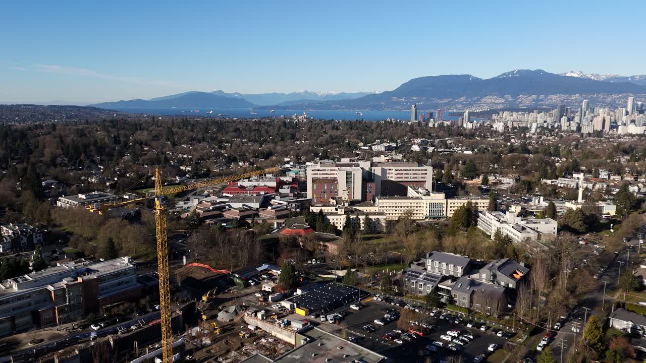 Construction Tower Crane Near B.C. Women's Hospital And Health Centre In Vancouver, Canada. Aerial Drone Shot