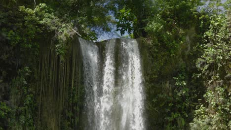 panoramic green tropical jungle landscape at camugao falls philippines asian water falling around tranquil scenario, southeast travel destination