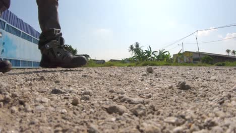slow mo kick on ground with sands (reversed)