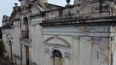 Crane-shot-rises:-facade-architecture-of-old-colonial-building-ruin