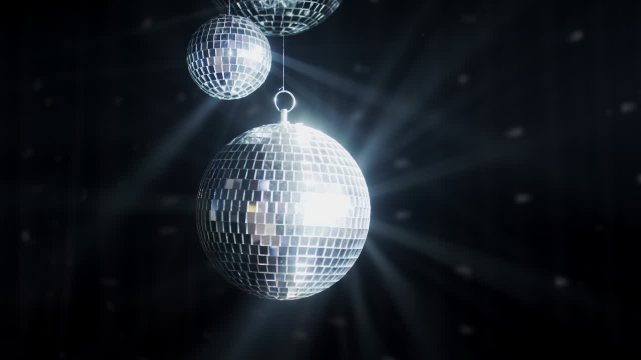 Disco mirror ball in the center of the smoke.