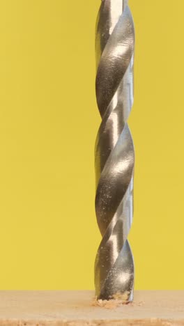 drill bit drilling into wood