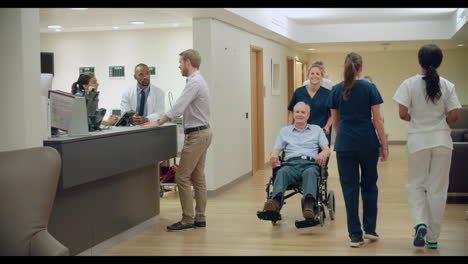 Busy-Nurse's-Station-In-Modern-Hospital