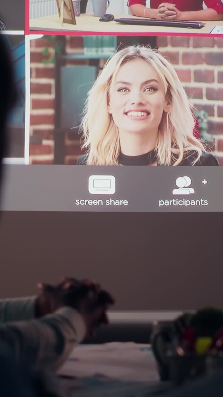 Vertical Video Multiethnic group attends a digital meeting from the office at night
