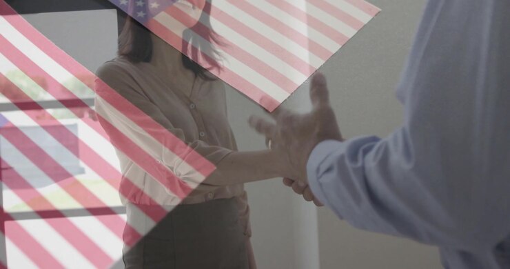 Woman extending hand, initiating business handshake, man gesturing then parting, US flag overlay