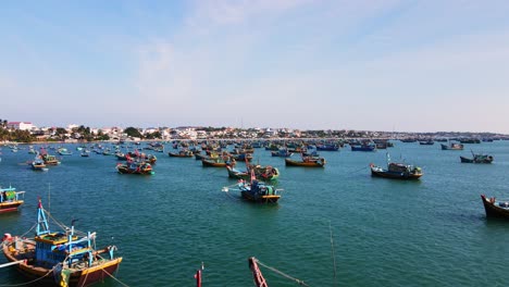 colorful fishing boats anchored in bay, fishing industry, mui ne, vietnam