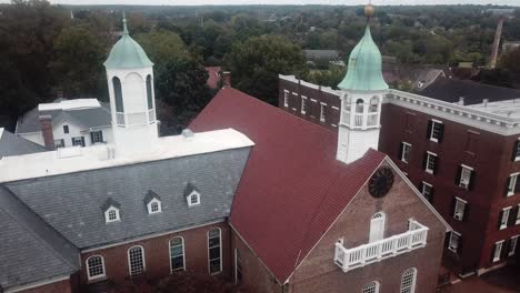 aerial view of a historic brick building with two towers