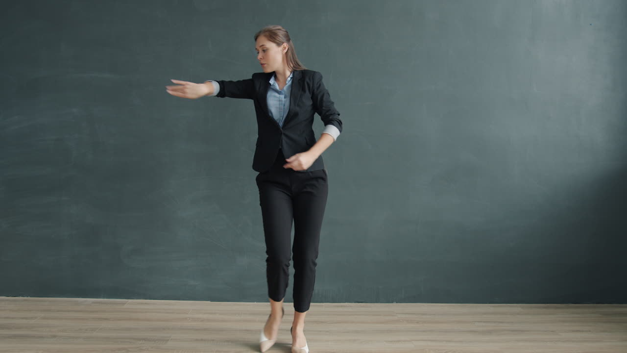 Businesswoman walking and dancing