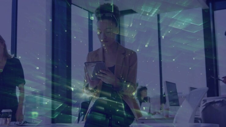 Woman tapping tablet and reviewing project data in business office, AR overlay highlighting tablet