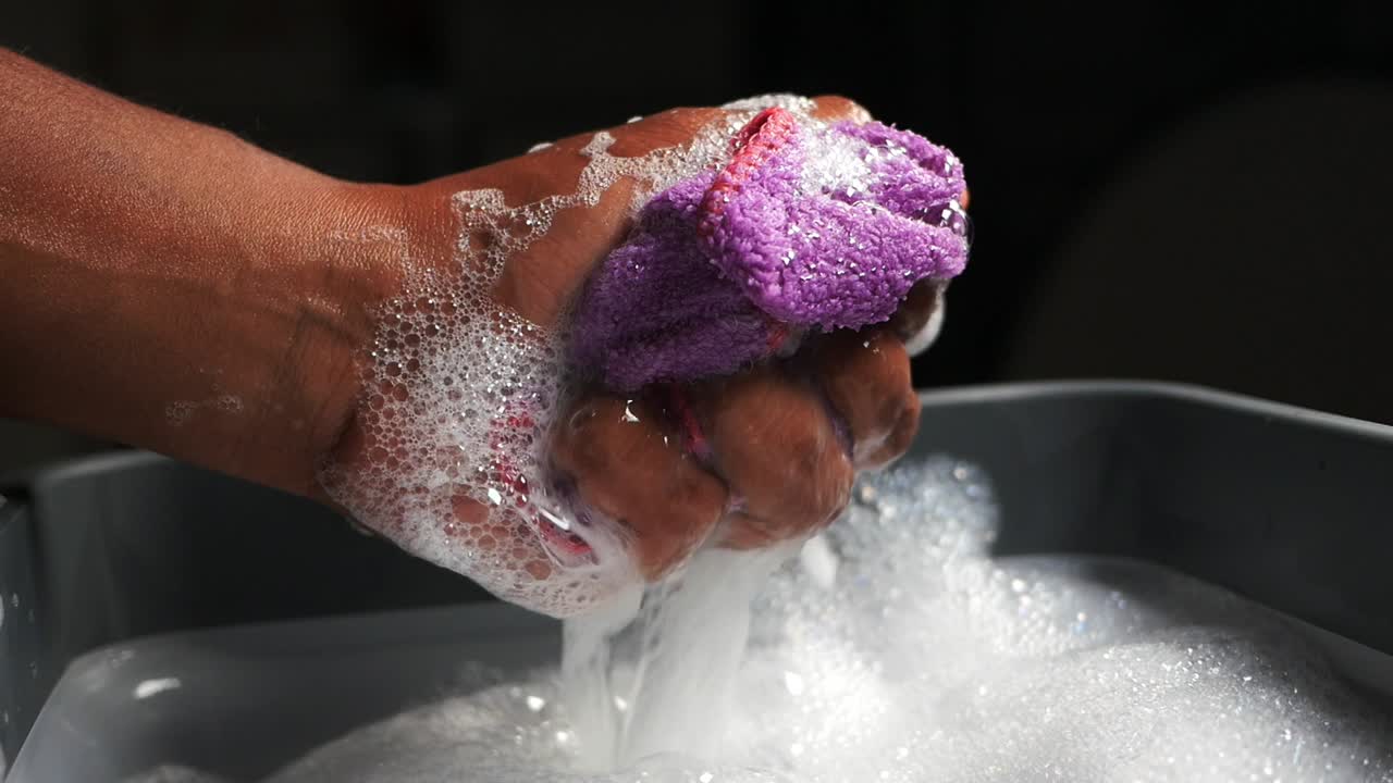 Washing a Cloth in Soapy Water