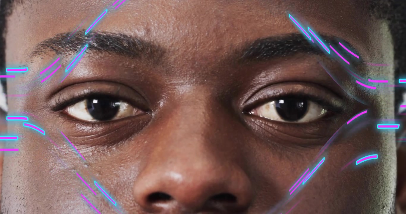 Man holding still generating neon AR overlays tracing facial features for technology demo