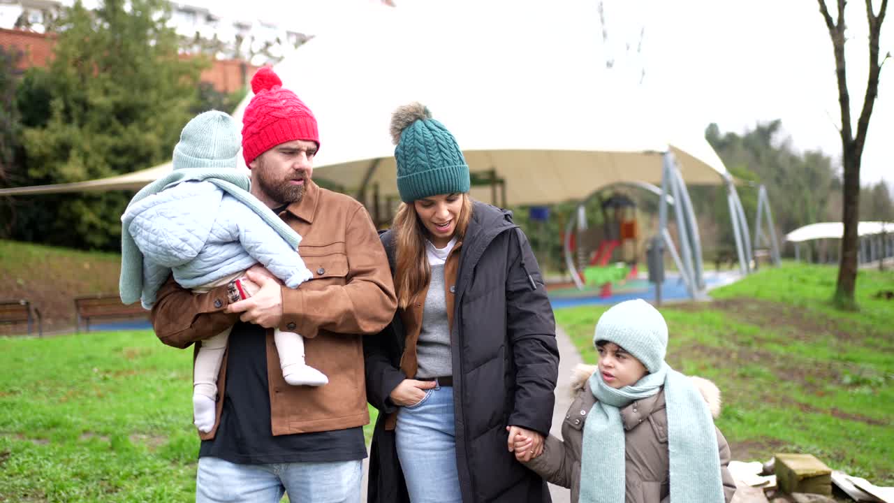 Family walking in the park on a winter day