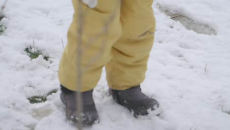 child walking in the snow