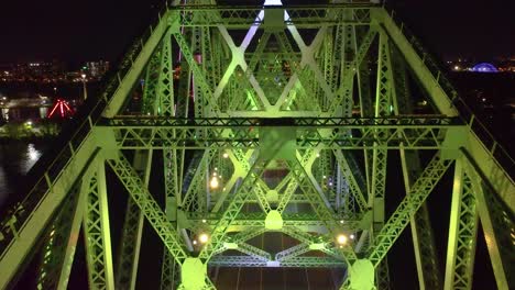 the jacques cartier bridge living in montreal, canada during nighttime. interactive experience of the bridge changing colors.