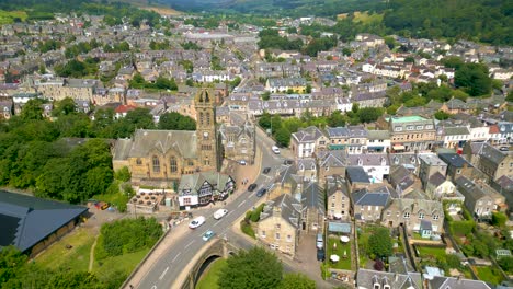 Aerial-Drone-shot-of-the-town-of-Peebles-in-the-Scottish-Borders-pulling-back-from-Peebles-Old-Parish-Church-towards-the-Tweed-Bridge