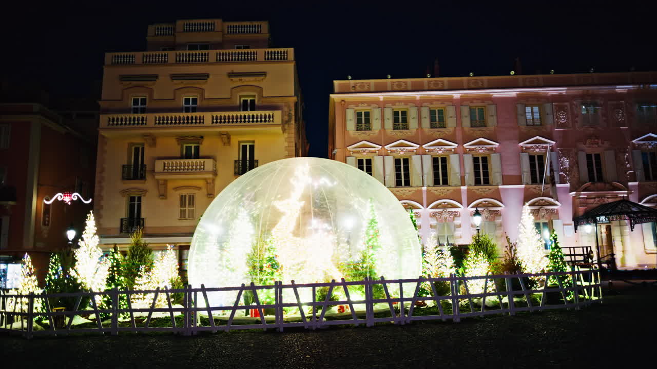 Big Christmas decorations in bubbles in front of the buildings in Monaco