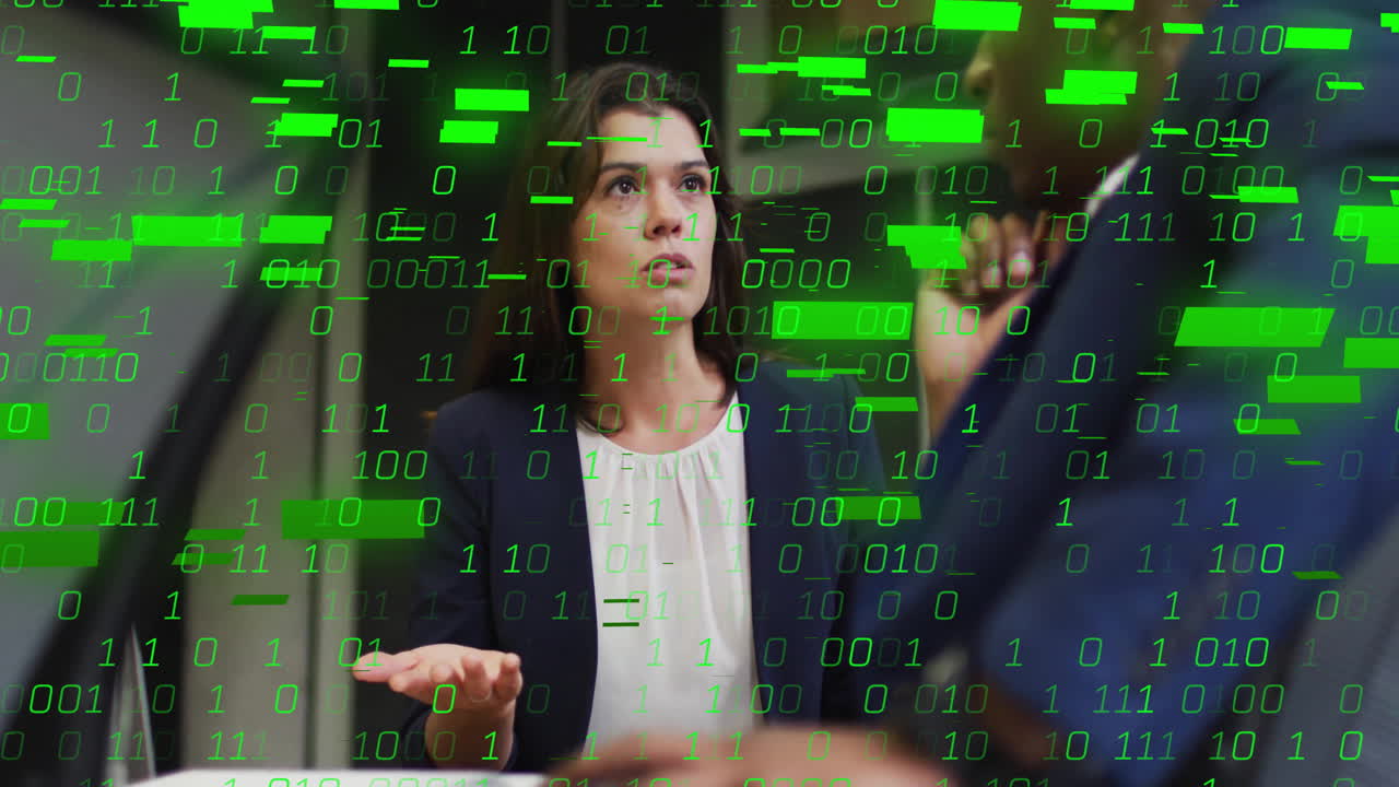 Discussing digital binary code animation, businesswoman and colleague in office meeting