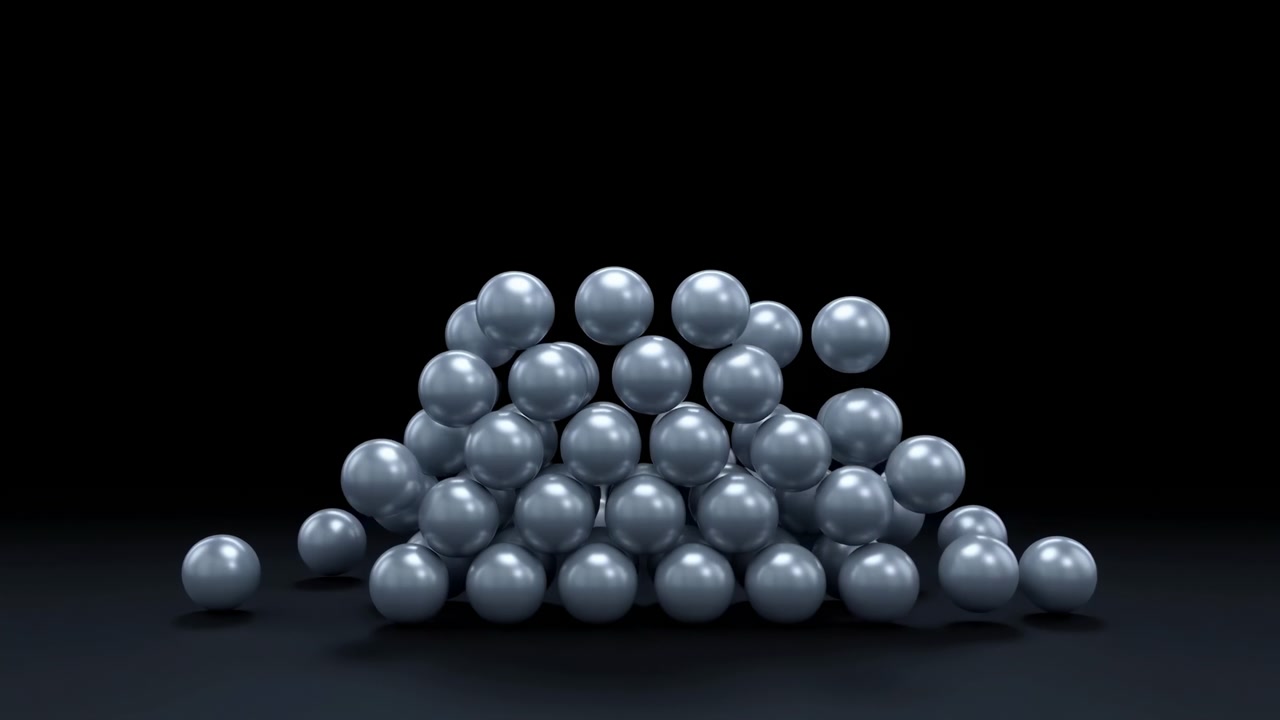 Pyramid of uniformly sized glossy steel blue spheres partially collapses into irregular scattered pile across matte black studio floor, with soft frontal light, subtle reflections, and elegant