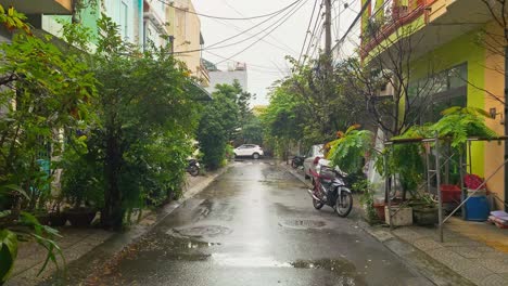 local asian vietnamese urban neighborhood street after rainy weather during cloudy day