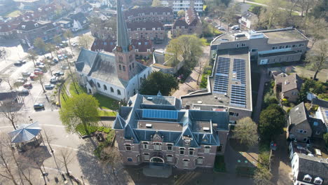 jib down of solar panels on rooftop of old monumental building