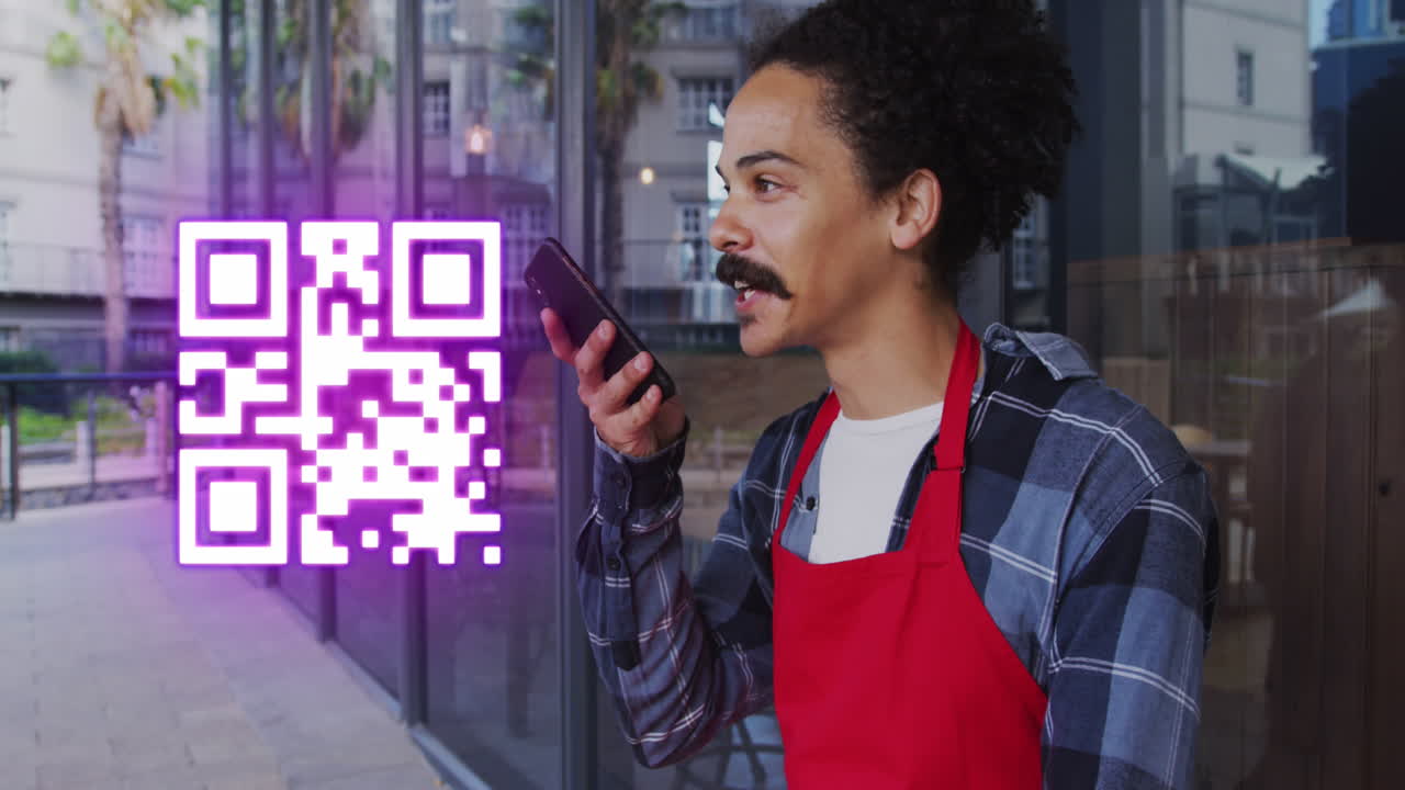 Animation of qr code over biracial businessman talking on smartphone