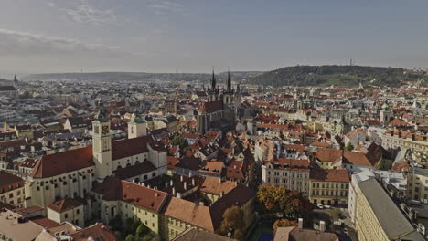 Prague-Czechia-Aerial-v115-drone-flyover-Church-of-Our-Lady-before-Týn-between-gothic-spires-twin-towers-across-Old-Town-Square-capturing-historic-cityscape---Shot-with-Mavic-3-Cine---November-2022