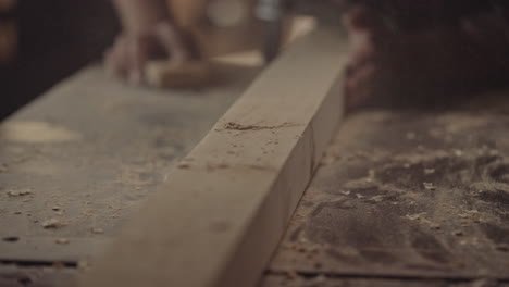 sanding wood plank