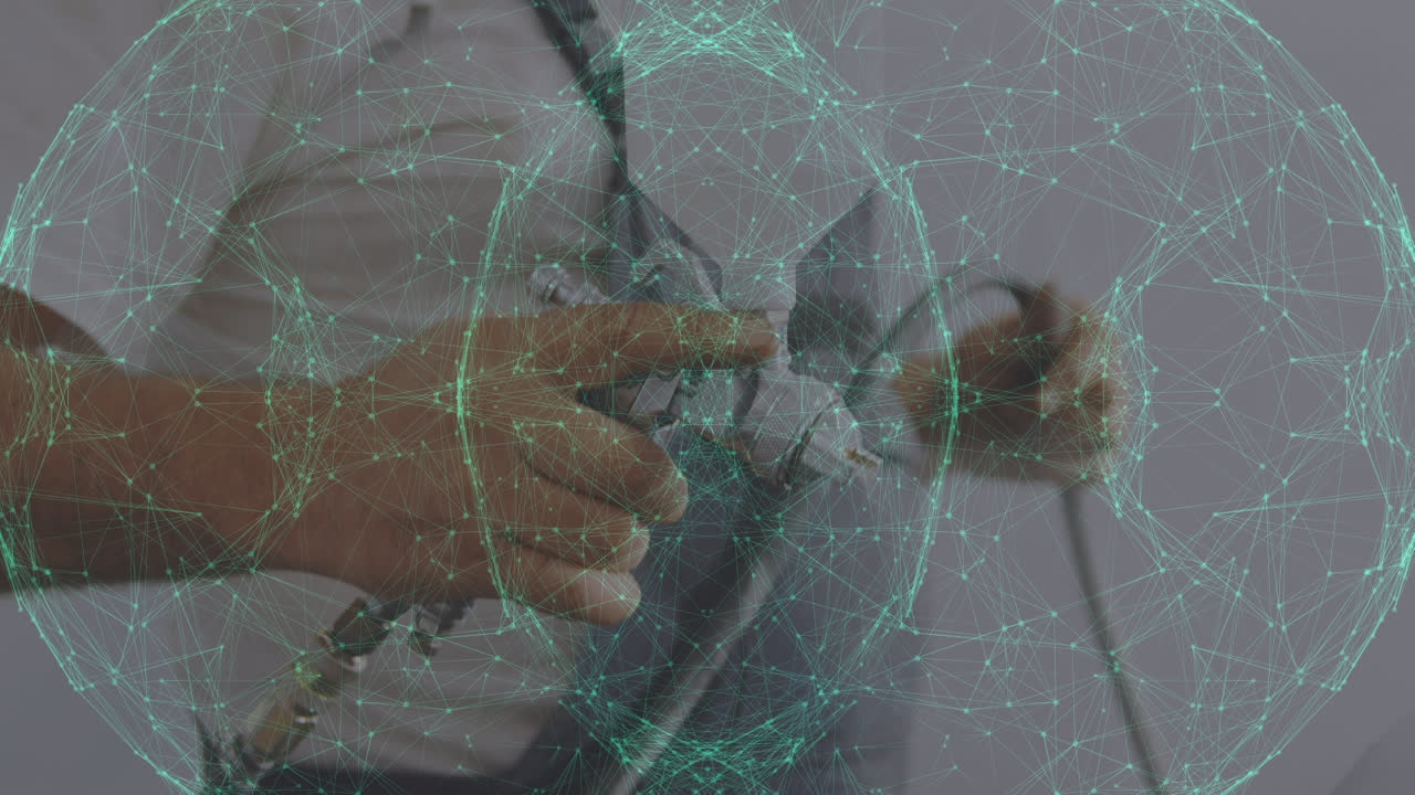 animación de puntos de conexión sobre el reparador caucásico con máscara, pintura en aerosol de piezas de automóviles