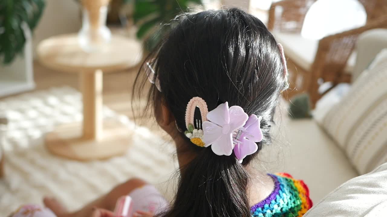 Girl with flower hair clips