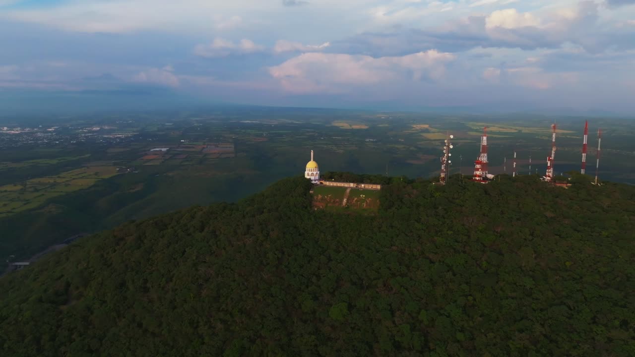 Aerial View of a Hilltop with a Temple and Communication Towers