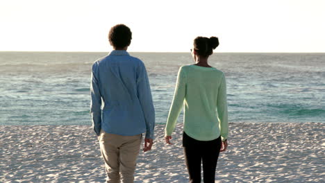 hand in hand at the beach