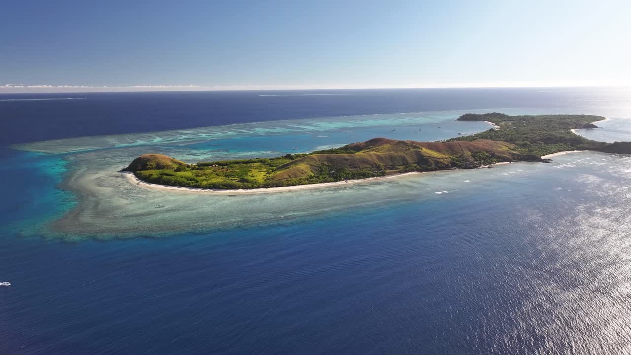Mana Island, Fiji. Paradise island in Pacific, tropical travel destination. Aerial wide.
