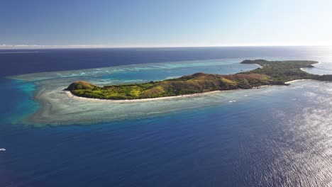 mana island, fiji. paradise island in pacific, tropical travel destination. aerial wide.